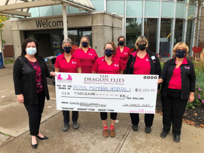 Dragon Flies present milestone gift during Breast Cancer Awareness Month
